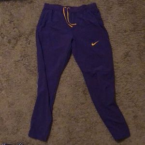 Comfortable, zipper pockets, purple LSU pants, yellow Nike sign, Dri-fit